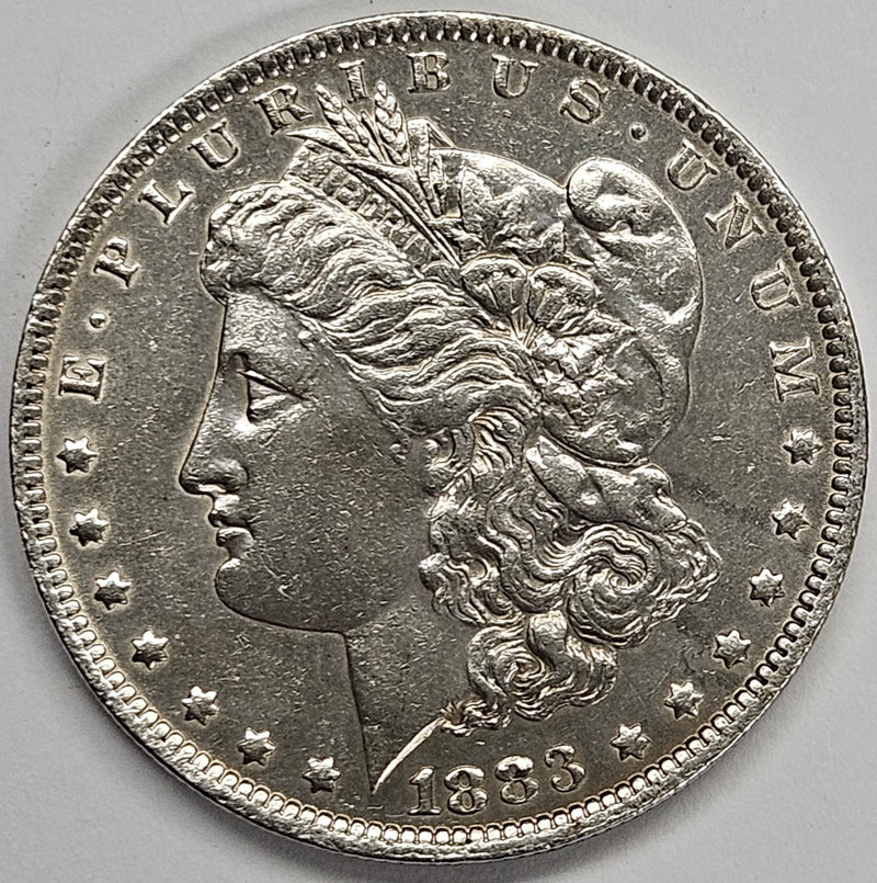 1883-O Morgan Dollar . . . . AU cleaned