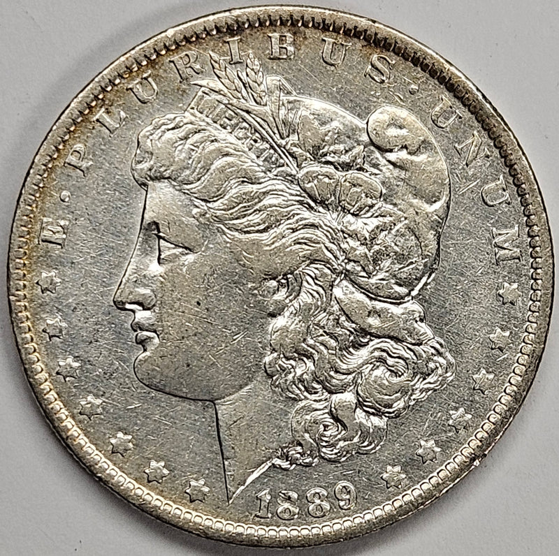 1889-O Morgan Dollar . . . . AU cleaned