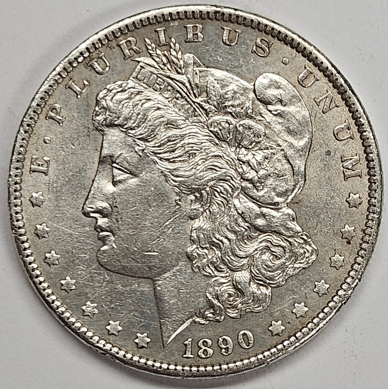 1890 Morgan Dollar . . . . BU rim hits